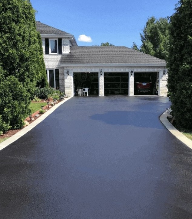 Driveway after Prototype Paving sealcoating — deep, even black finish